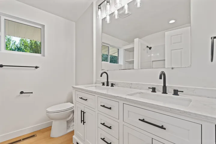 Double vanity with dual undermount sinks and matte black fixtures