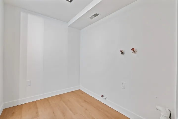 Wood-finish flooring with white walls
