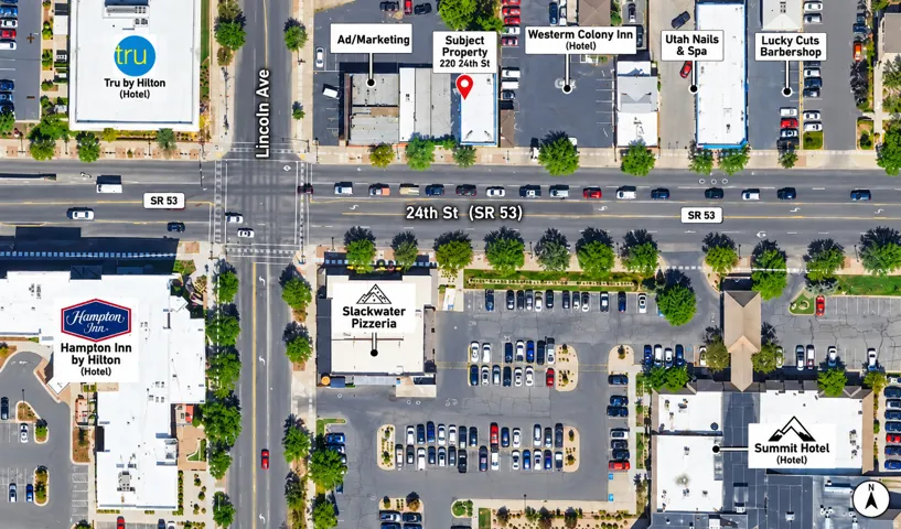 Aerial Map. Outlining the property at 220 24th St and its surrounding commercial and lodging establishments