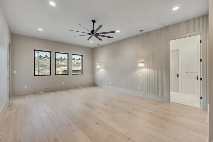 Wood-finish flooring, recessed lighting, and a modern ceiling fan