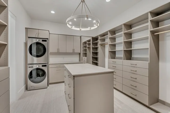 Custom cabinetry with extensive shelving and drawer storage