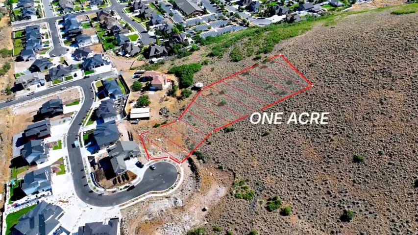 One-acre lot with defined boundaries and surrounding residential properties