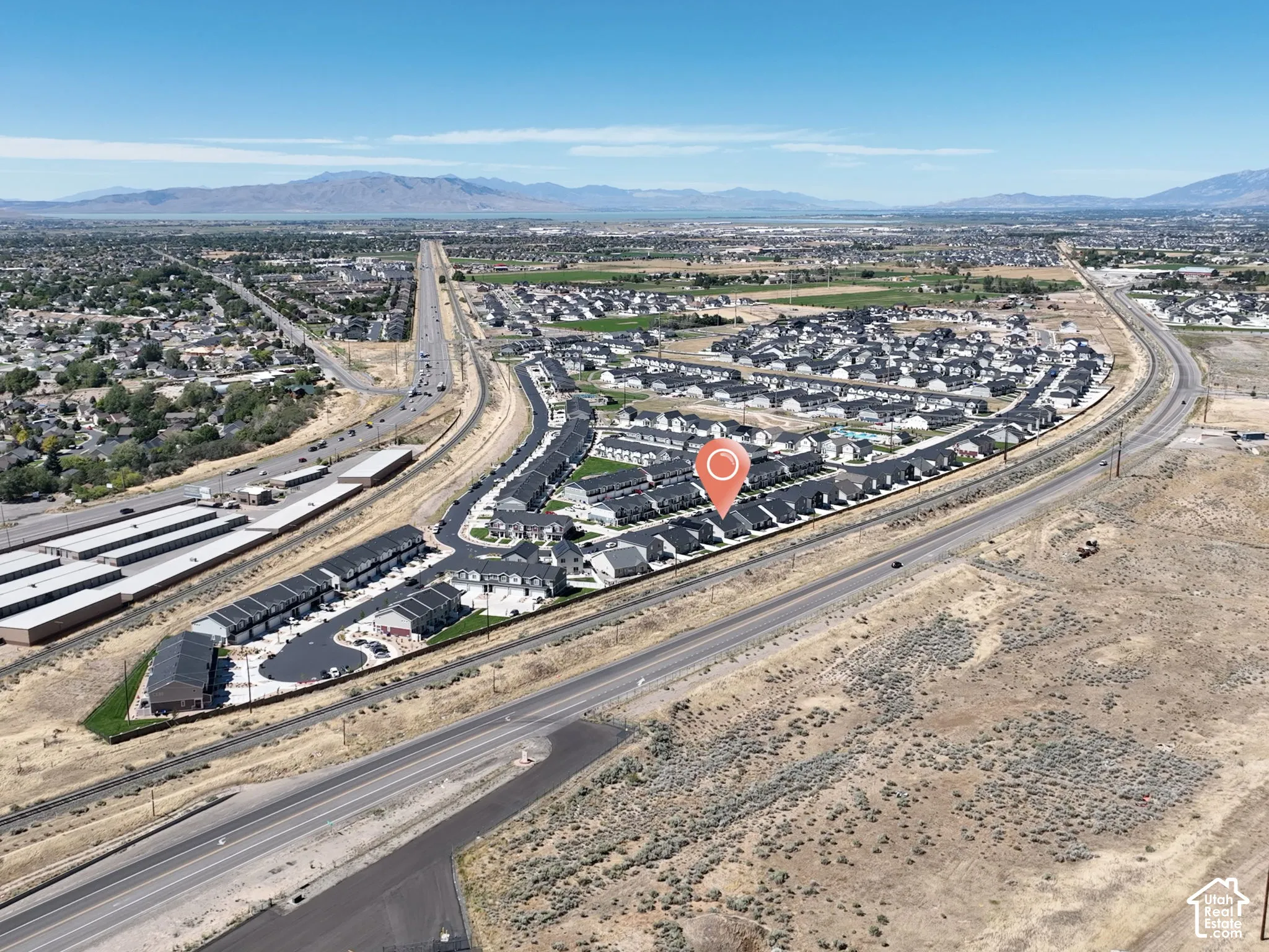 Townhome community with mountain scenery, multiple buildings, and proximity to major roadways