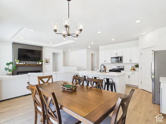 Open-concept living space featuring wood-finish flooring