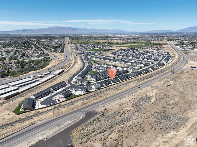 Townhome community with mountain scenery, multiple buildings, and proximity to major roadways