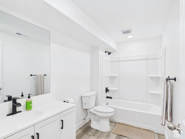 White vanity with integrated sink and matte black faucet