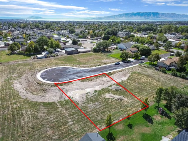Expansive vacant land parcel with mountain backdrop, situated on a cul-de-sac