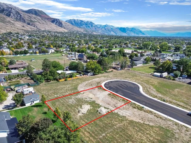 Level lot with a paved cul-de-sac and mountain backdrop