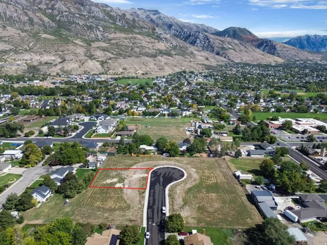 Expansive land parcel featuring a cul-de-sac and mountain backdrop