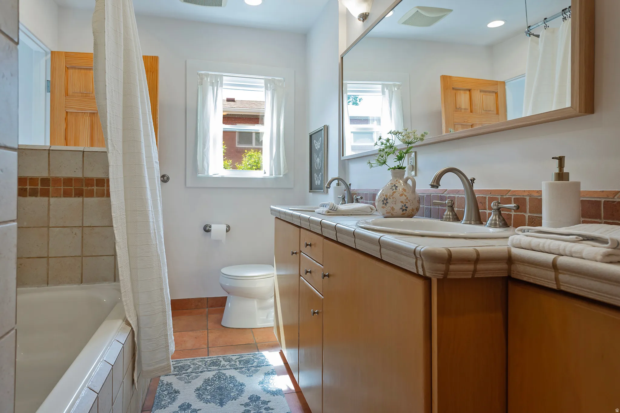 Dual vanity with undermount sinks and brushed nickel fixtures