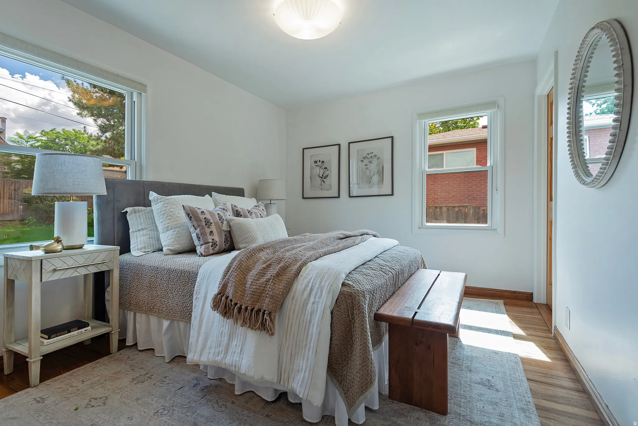 Recessed lighting, wood flooring, and white walls