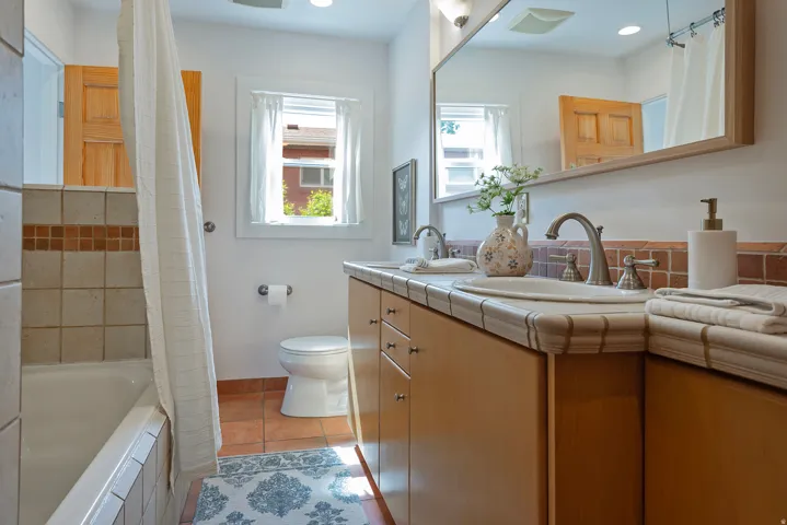 Dual vanity with undermount sinks and brushed nickel fixtures