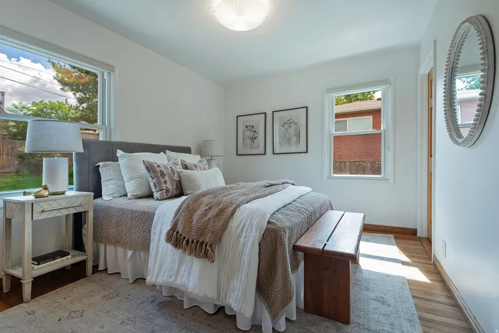Recessed lighting, wood flooring, and white walls