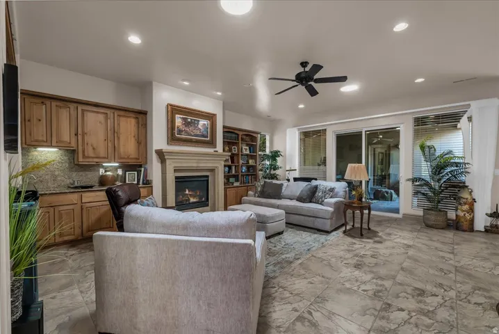 Recessed lighting, ceiling fan, and tile flooring