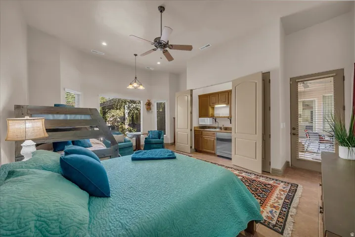 High ceilings with recessed lighting, integrated ceiling fan, and pendant lighting