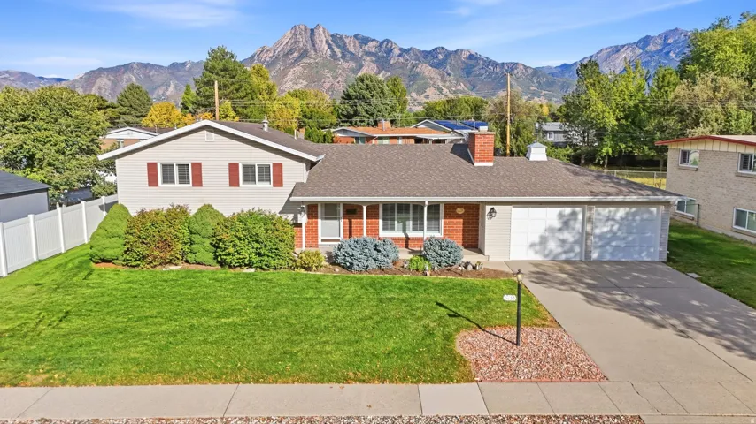 Red brick and siding exterior with a two-car garage