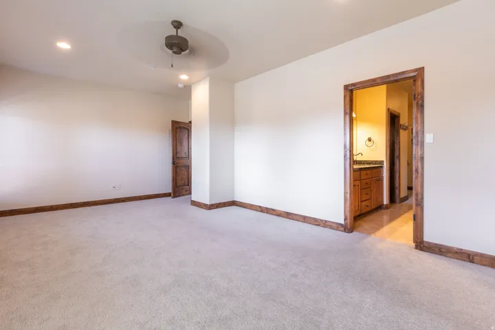 Carpet flooring with wood trim and solid wood doors