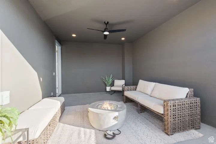 Covered patio with recessed lighting, ceiling fan, and concrete flooring