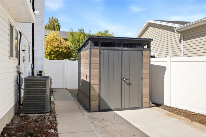 Outdoor storage shed featuring dual doors and transom windows