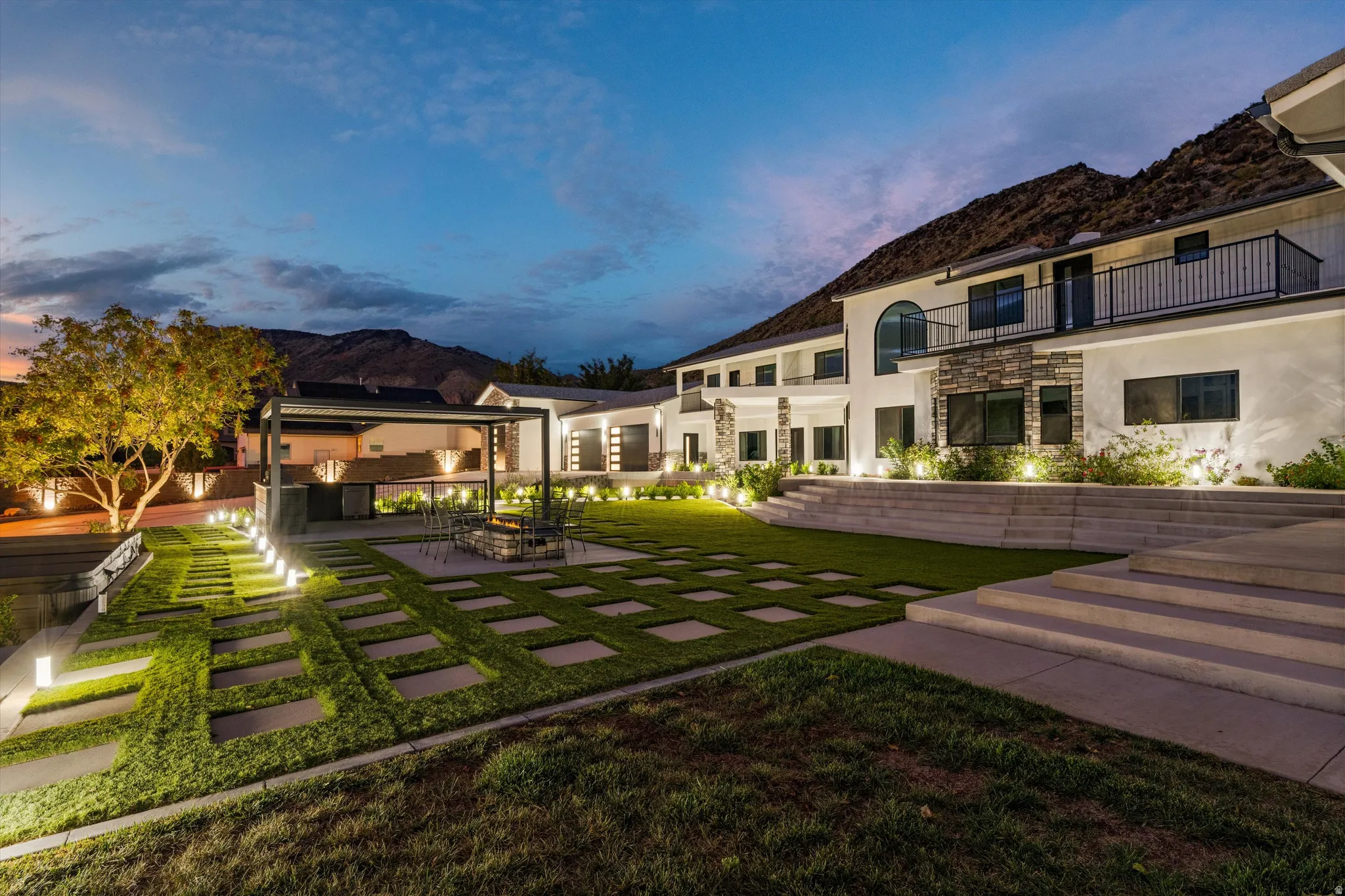 Expansive terraced yard with a paver pathway