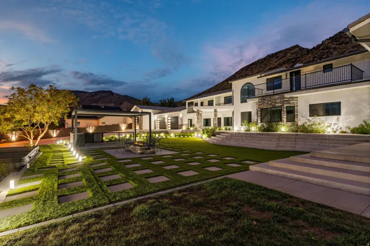 Expansive terraced yard with a paver pathway