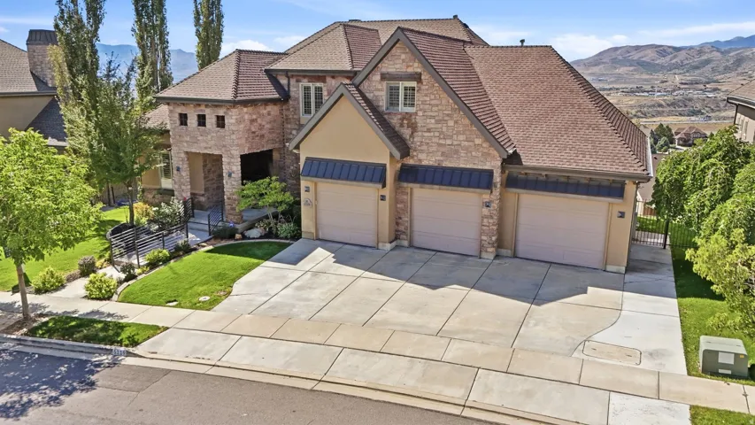Stone and stucco exterior with a multi-gabled roof