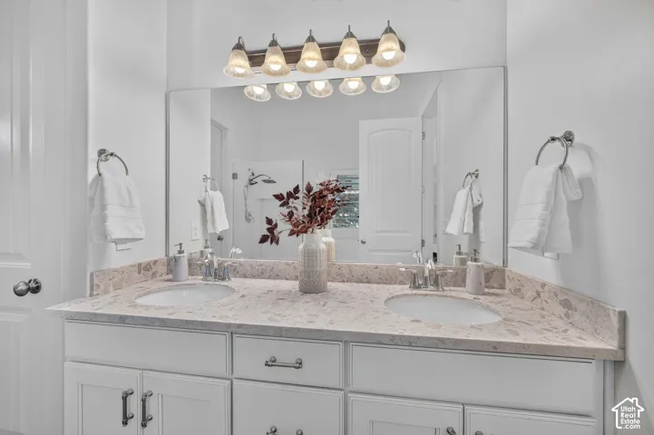 Double vanity with integrated sinks and stone-finish countertop