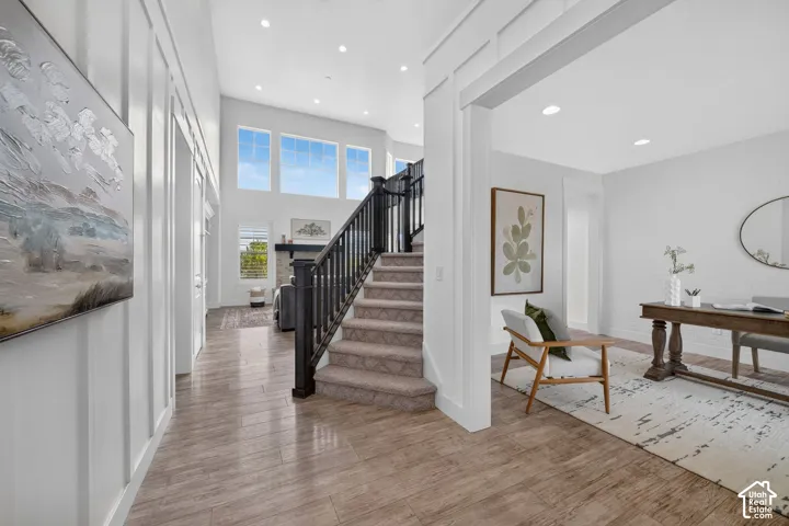 Grand entry foyer with wood-finish flooring