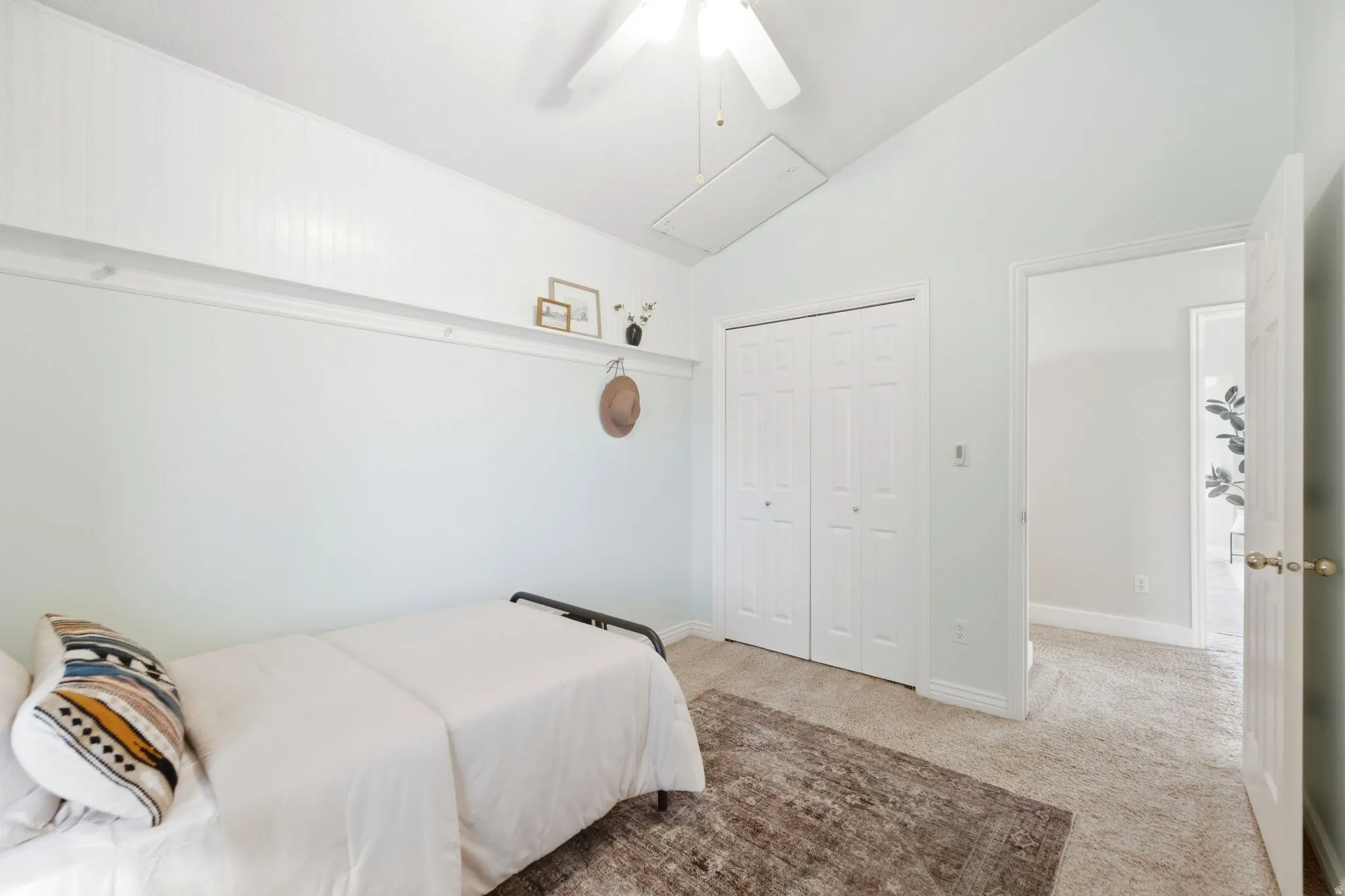Third upstairs bedroom with vaulted ceilings, cozy window seat, and incredible mountain views