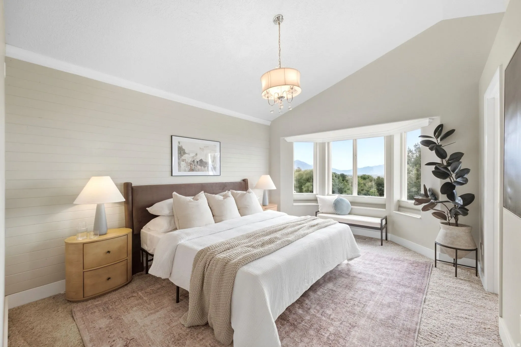 Primary bedroom with vaulted ceilings, full natural light, and spectacular mountain, lake, and valley views