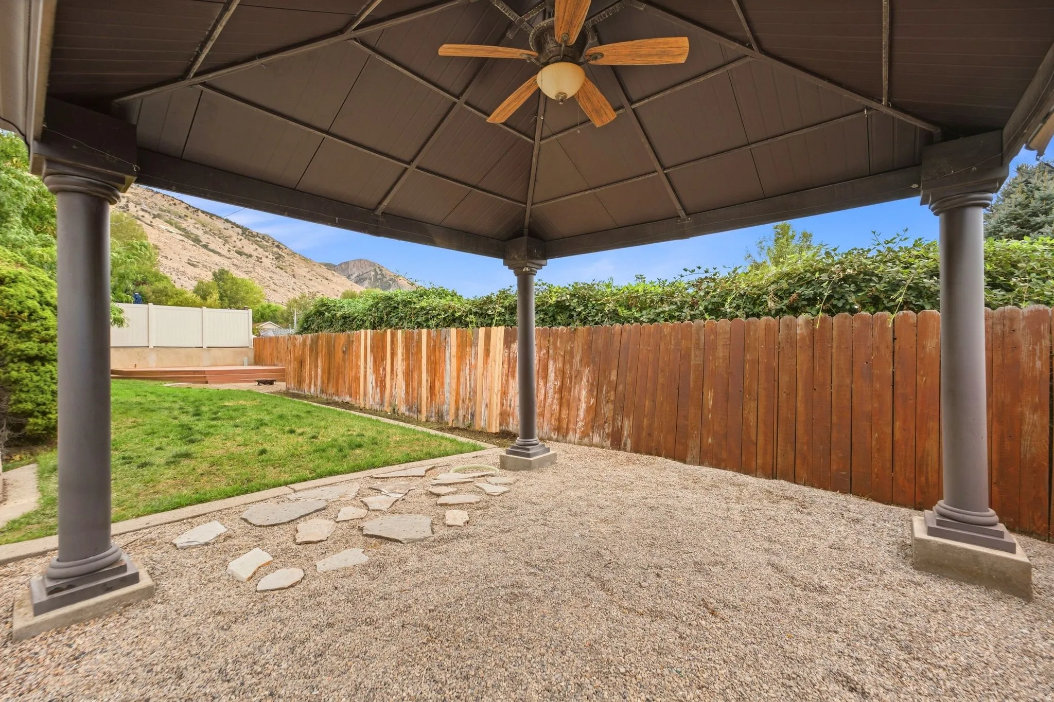 Gazebo for covered seating in a private backyard with mountain views