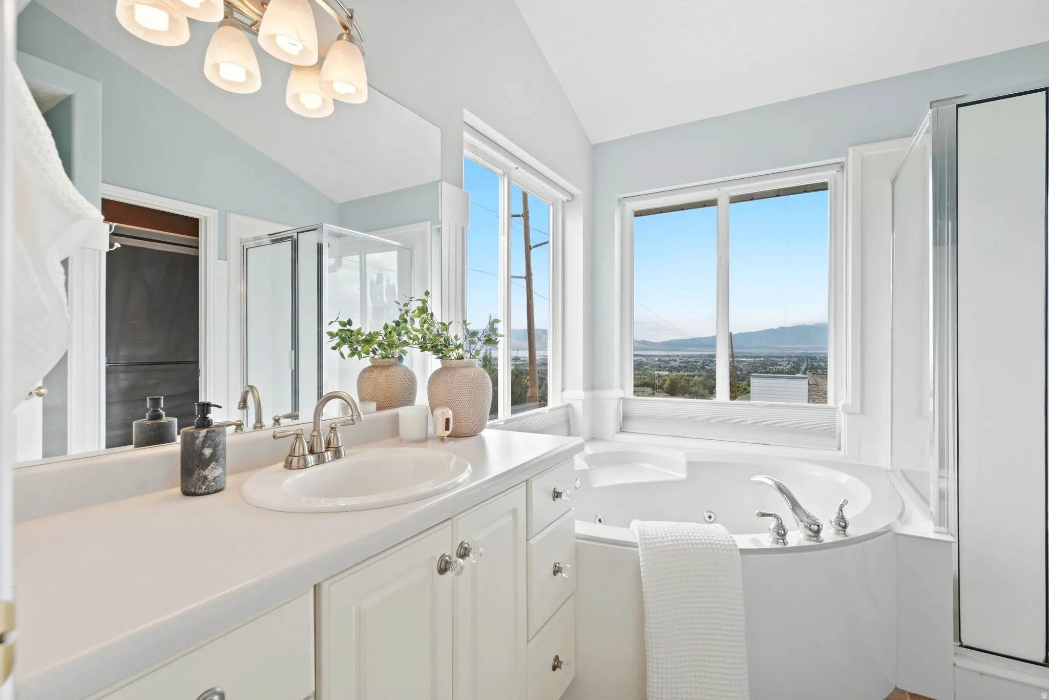 Ensuite primary bathroom with a separate built-in jetted tub,  with spectacular views (Imagine taking a bath and watching the sunset here), separate shower.