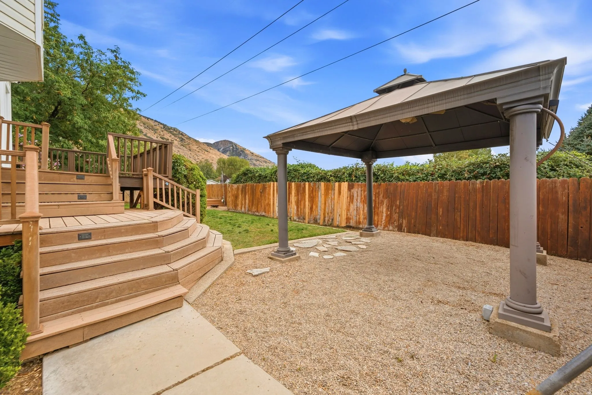 Tiered back deck with a view of the gazebo and the mountains
