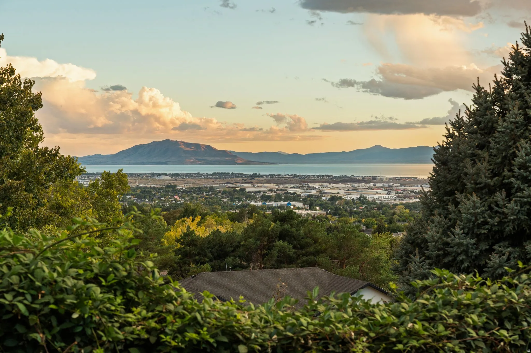 Panoramic mountain backdrop with a large body of water