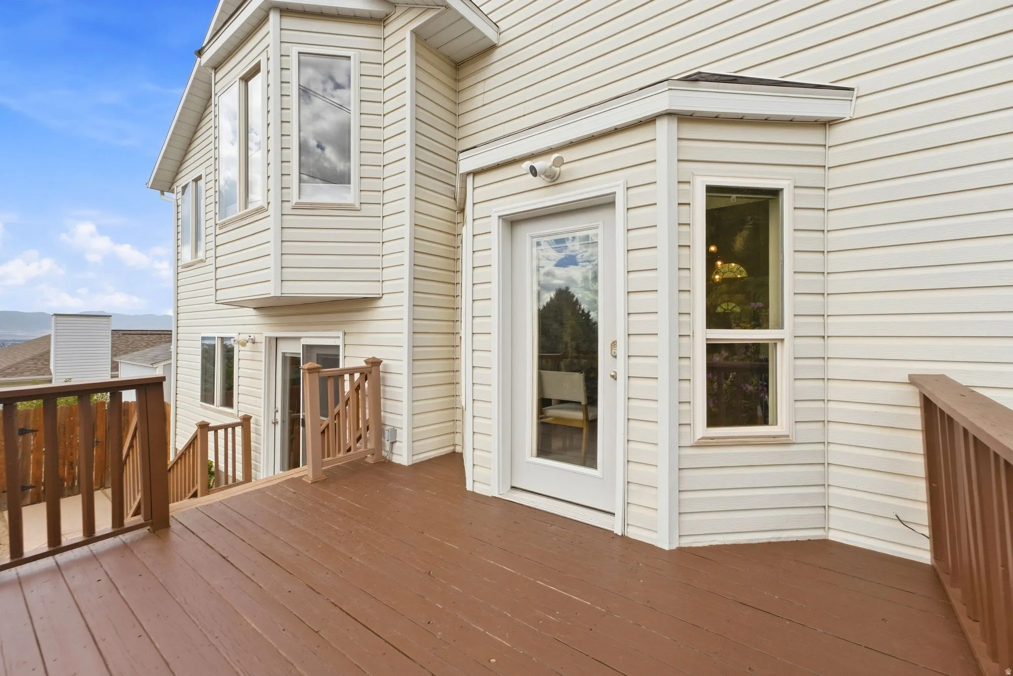 View of the back deck showing the entrance into the dining room and kitchen area