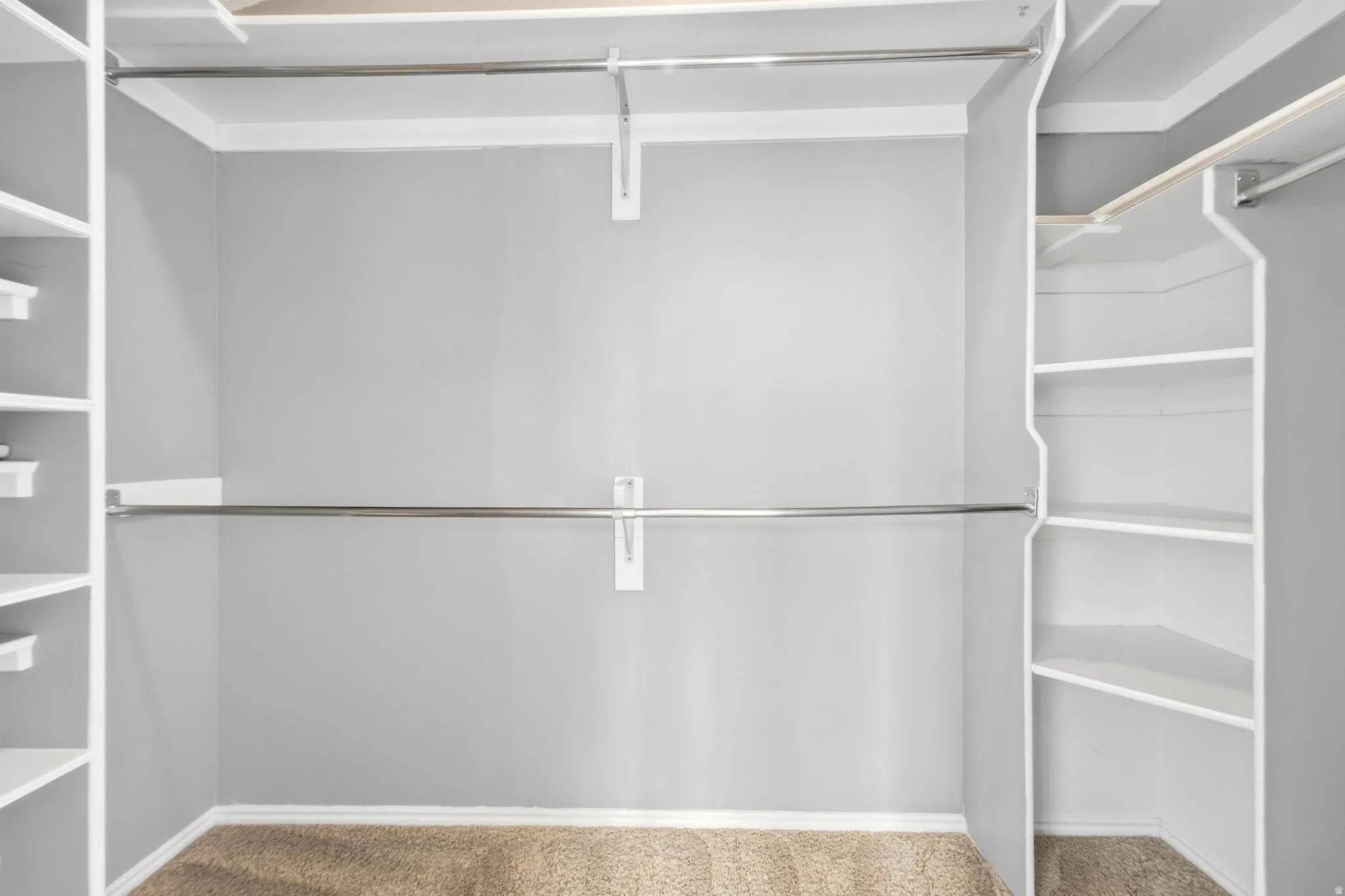 Large walk-in a closet attached to the primary ensuite bathroom