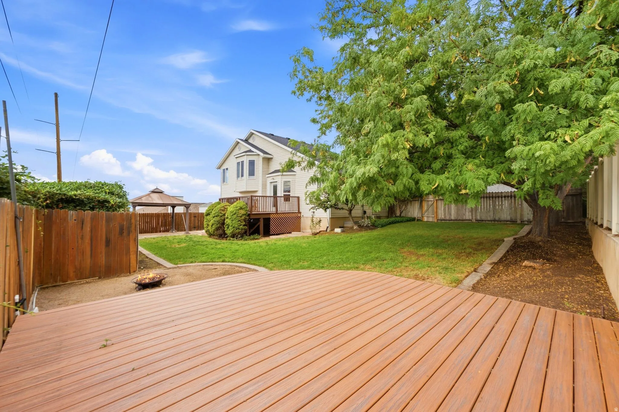 View of the yard from the back deck, showcasing the privacy and seclusion of the yard