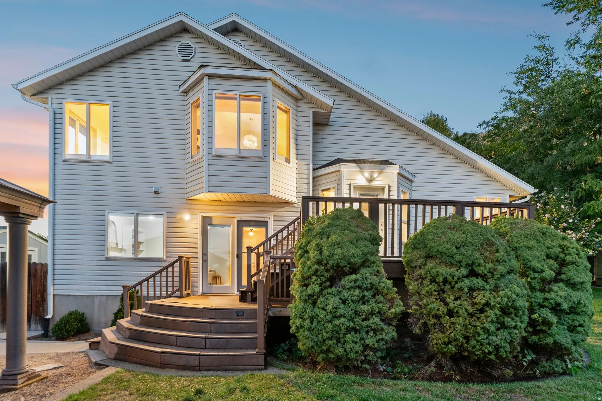 Back view of the home at twilight