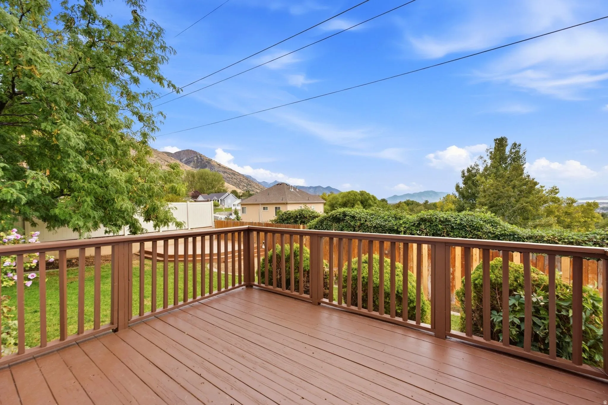 Back deck off of the kitchen and dining room with views of the mountains and the lake