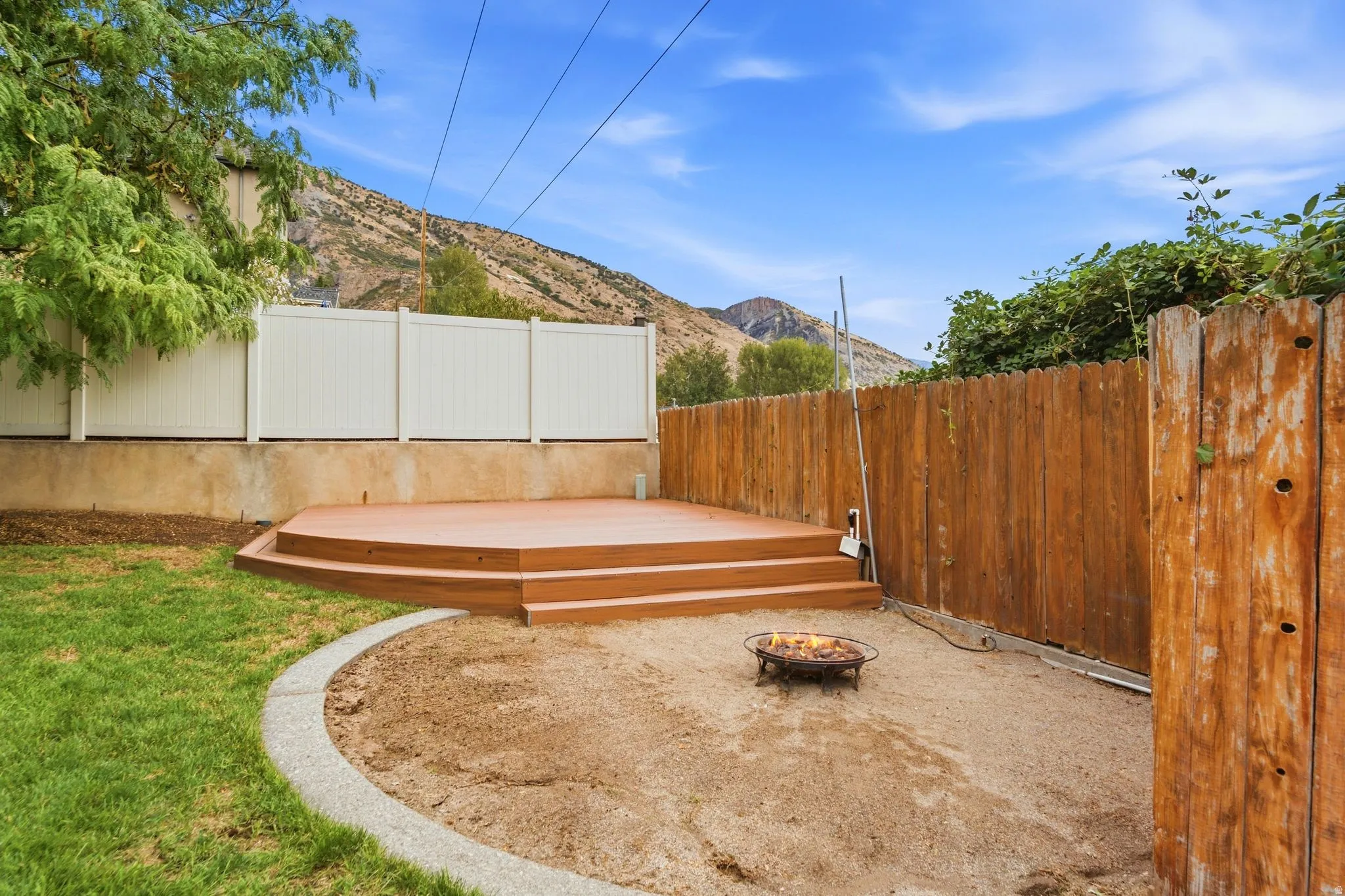 Additional elevated deck with lake and mountain views and a fire pit area for entertaining or enjoying quiet evenings at home