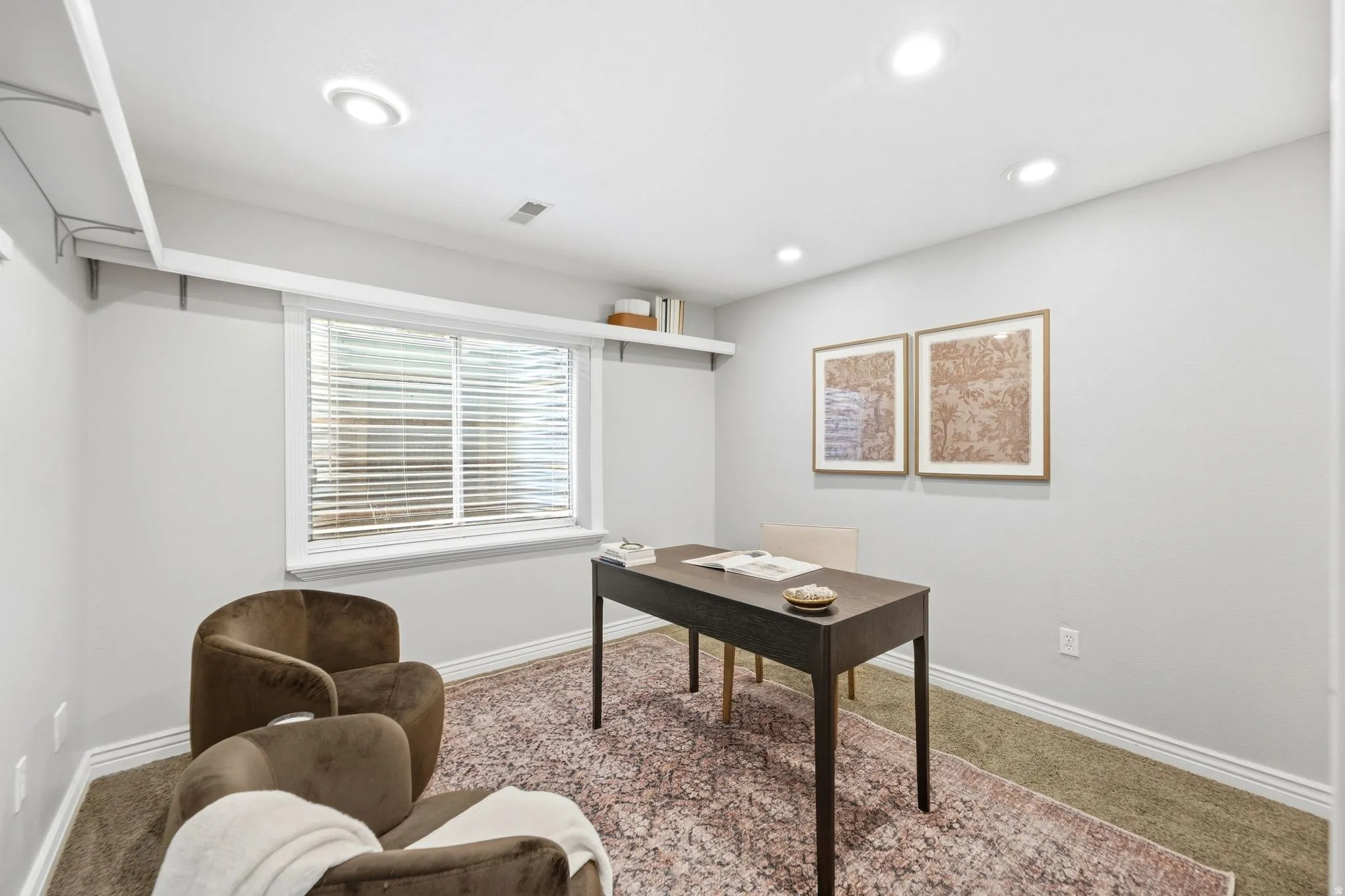Basement bedroom or office with full egress windows and ample closet space