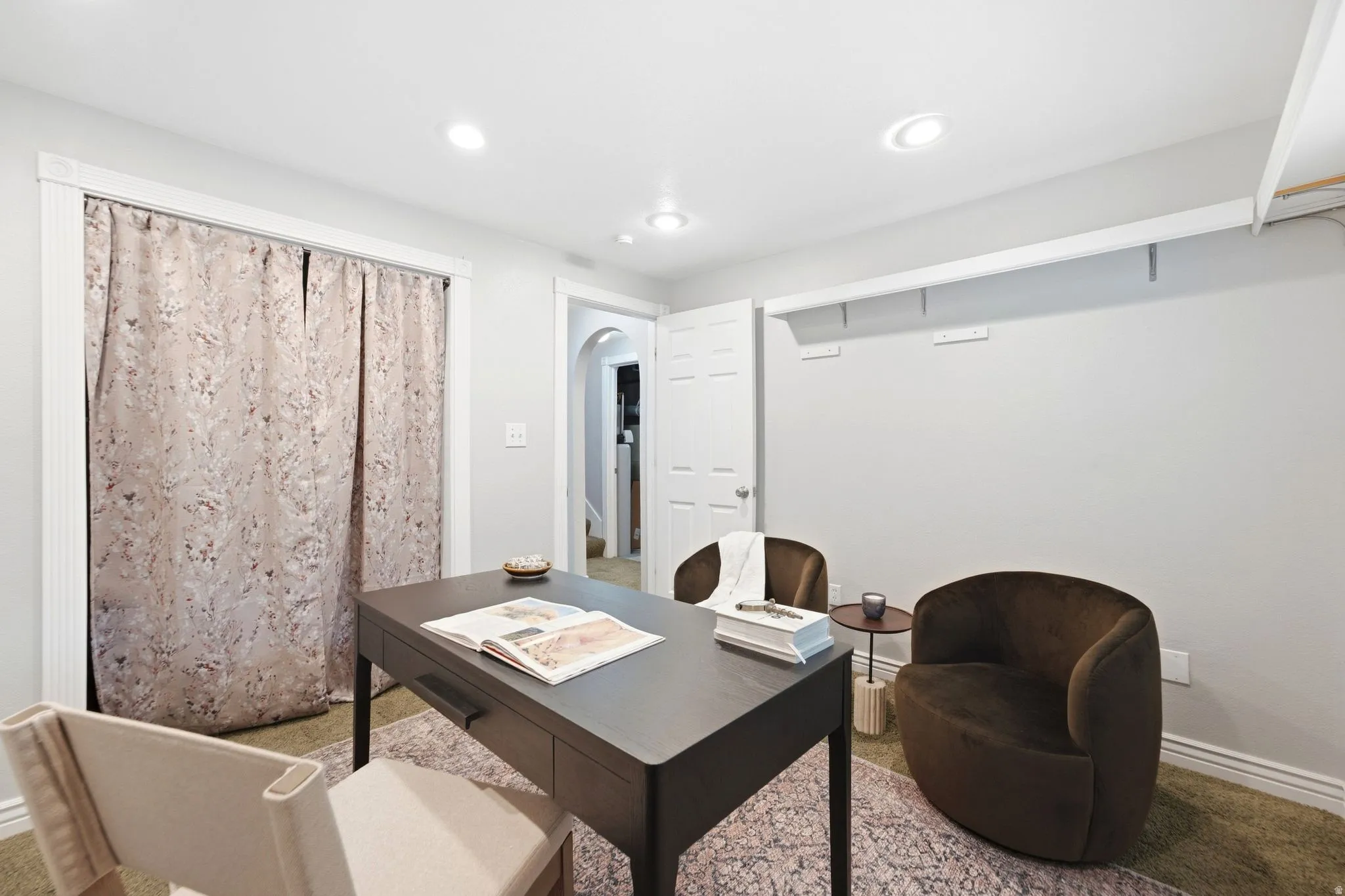 Basement bedroom or office with full egress windows and ample closet space