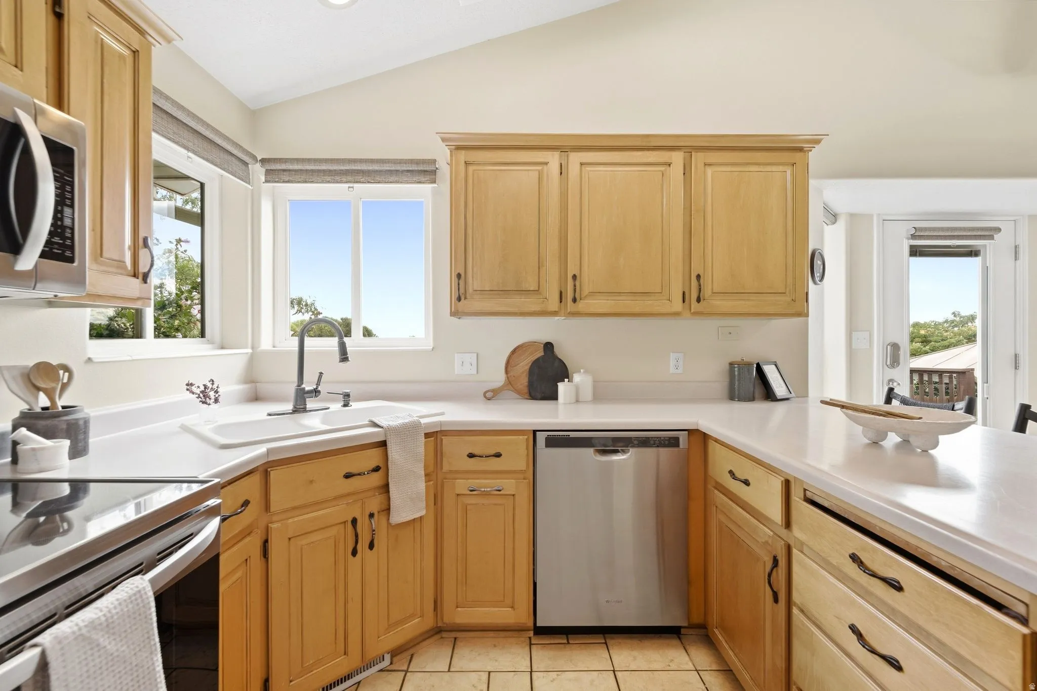 Kitchen view with ample natural light and stainless steel appliances