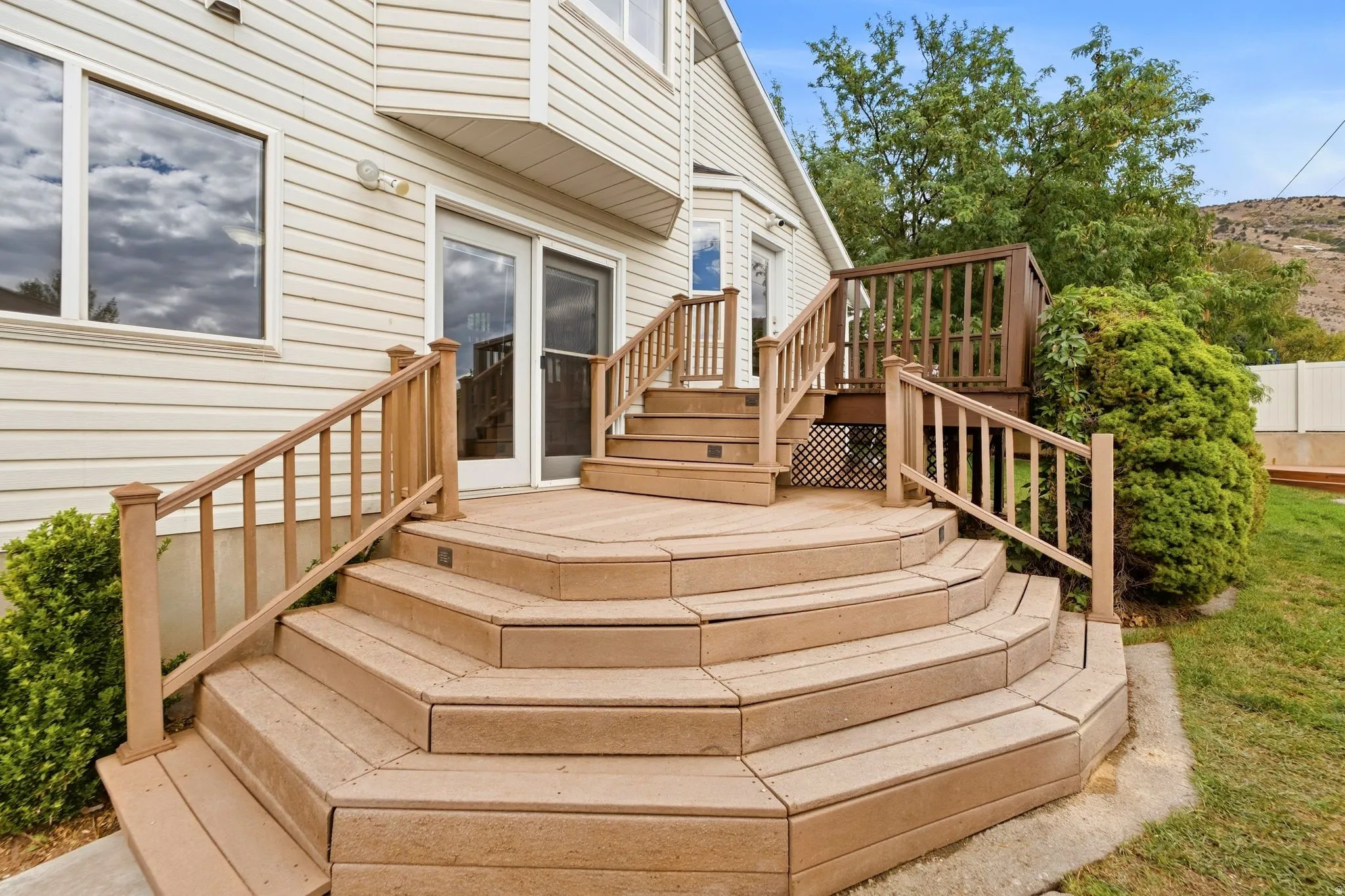 Step down of the deck and the door that enters the lower living room