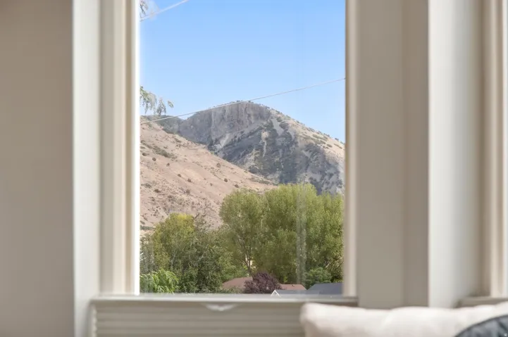 View from the bay window in the primary bedroom with incredible mountain and lake views.