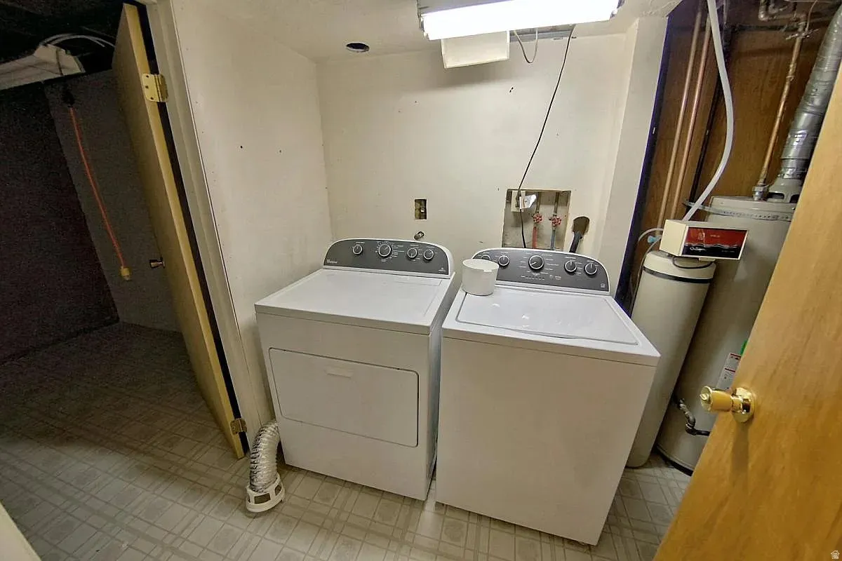 Laundry area with a water heater and water treatment system