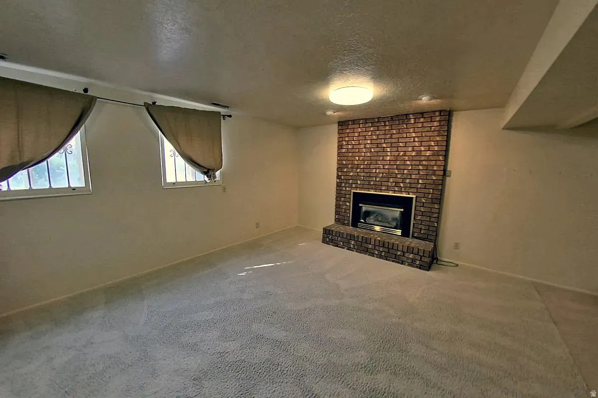 Brick fireplace with an integrated firebox and hearth