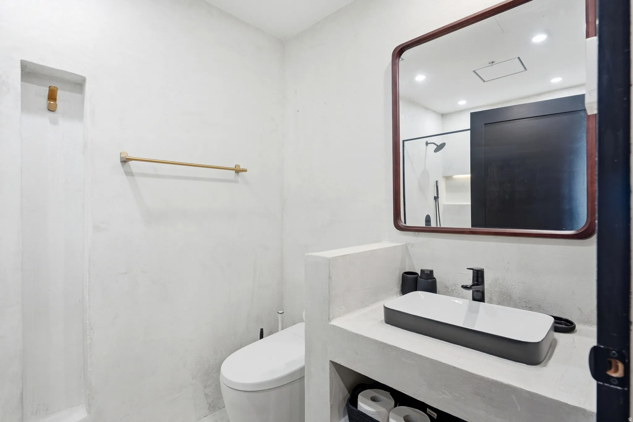 Contemporary vanity with integrated rectangular vessel sink and matte black faucet