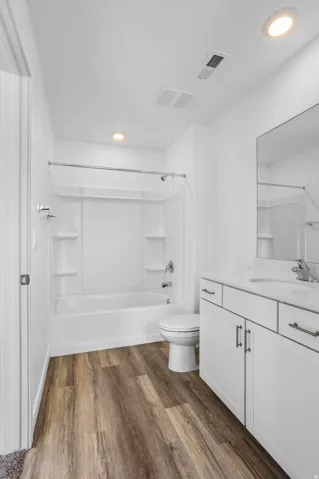 White vanity with an integrated sink and chrome fixtures