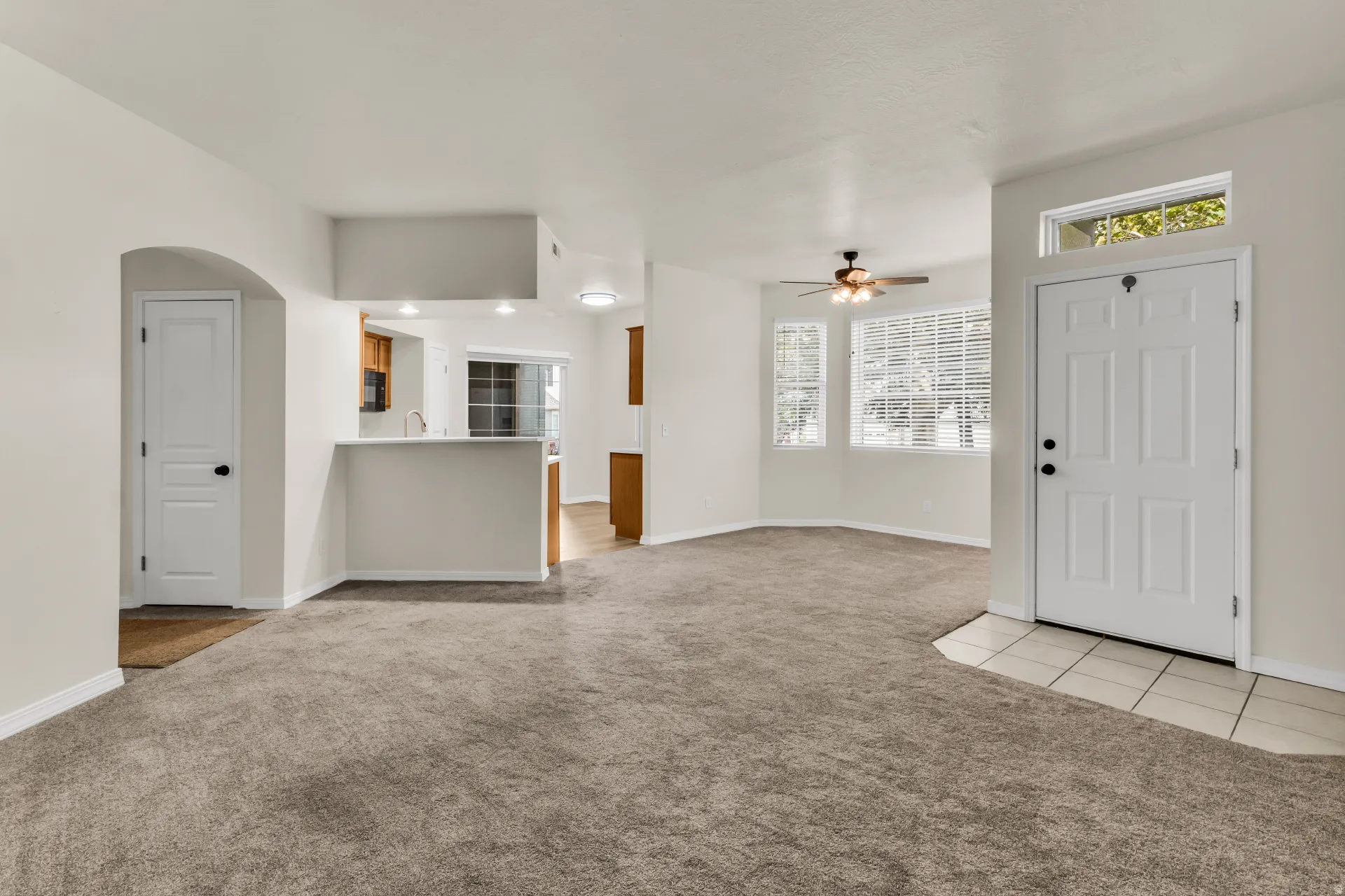 Living room, with view of dining area and kitchen.